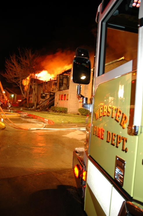 Structure on Fire Behind Webster Fire Department Truck
