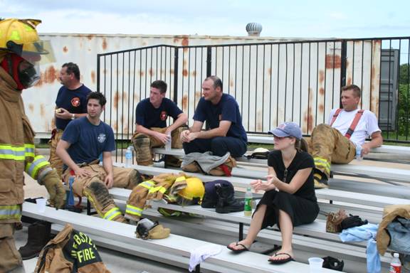 Fire fighters sitting on bleachers